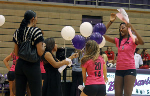 Danielle Cuttino (far right) enjoys a fun moment during Senior Night festivities. She is one of five seniors on this years volleyball team.