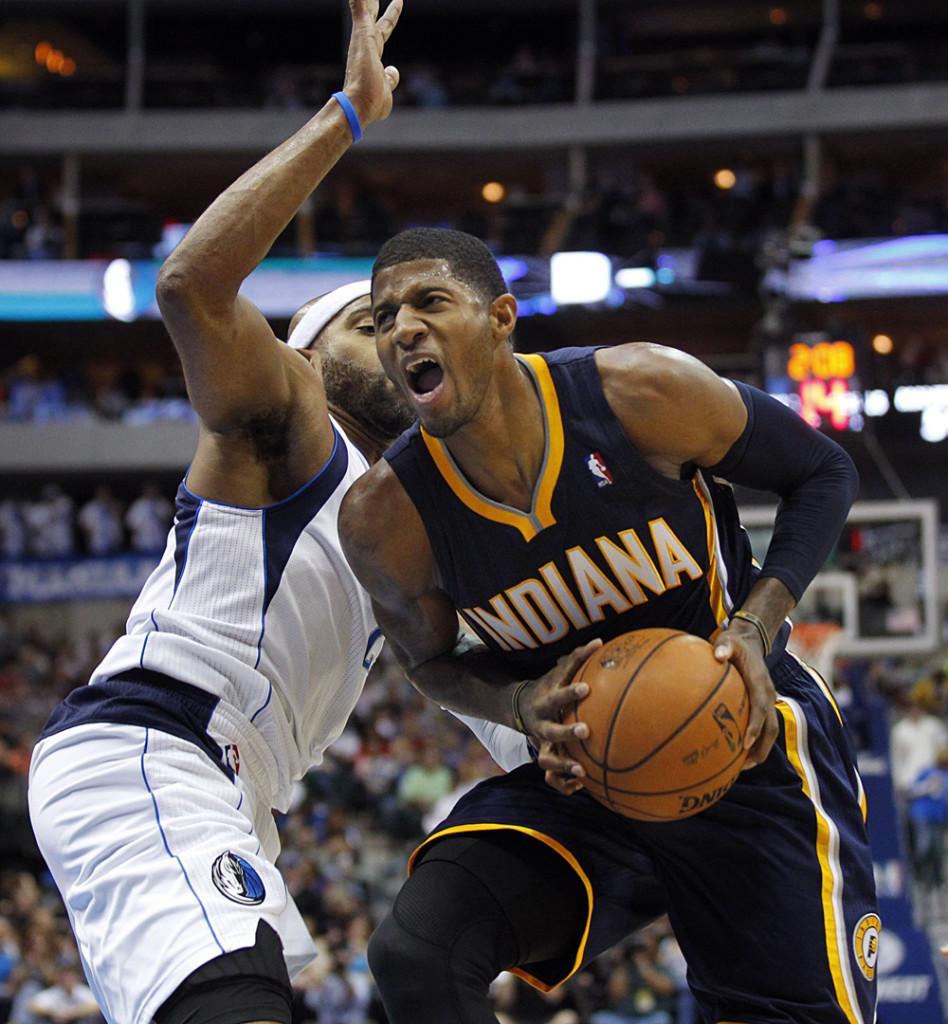 Paul George of the Indiana Pacers drives to the basket against the Dallas Mavs. George is averaging 24.9 points for the 8-0 Pacers.