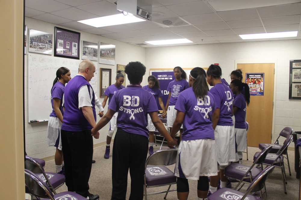 The team gathers in prayer prior to Thursday;s game against Decatur Central.