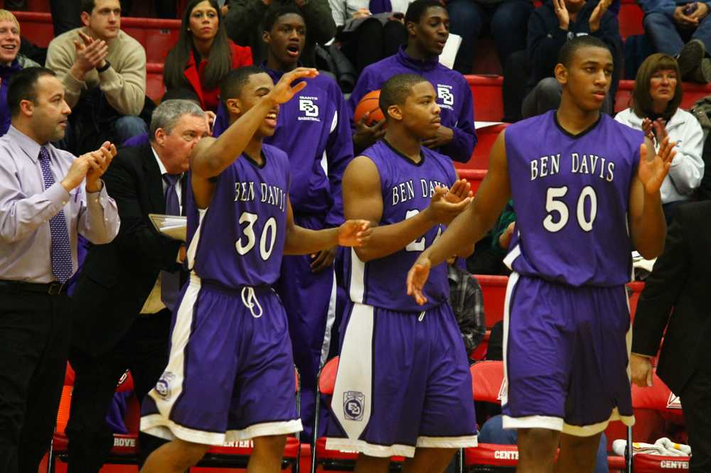 The team celebrates during the closing minutes of a 58-54 win at Center Grove.