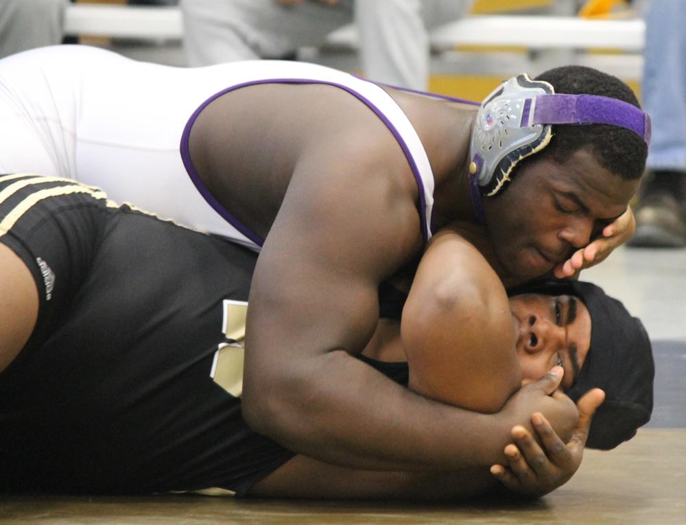 Junior heavyweight wrestler Norman Oglesby pins an opponent earlier this season. Olgesby is one of five wrestlers competing at the Evansville semistate this weekend.