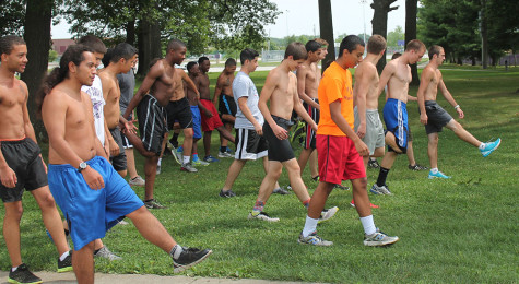 Members of the boys cross country team begin stretching exercises during a recent practice. The boys begin their season Aug. 23 at Plainfield. 