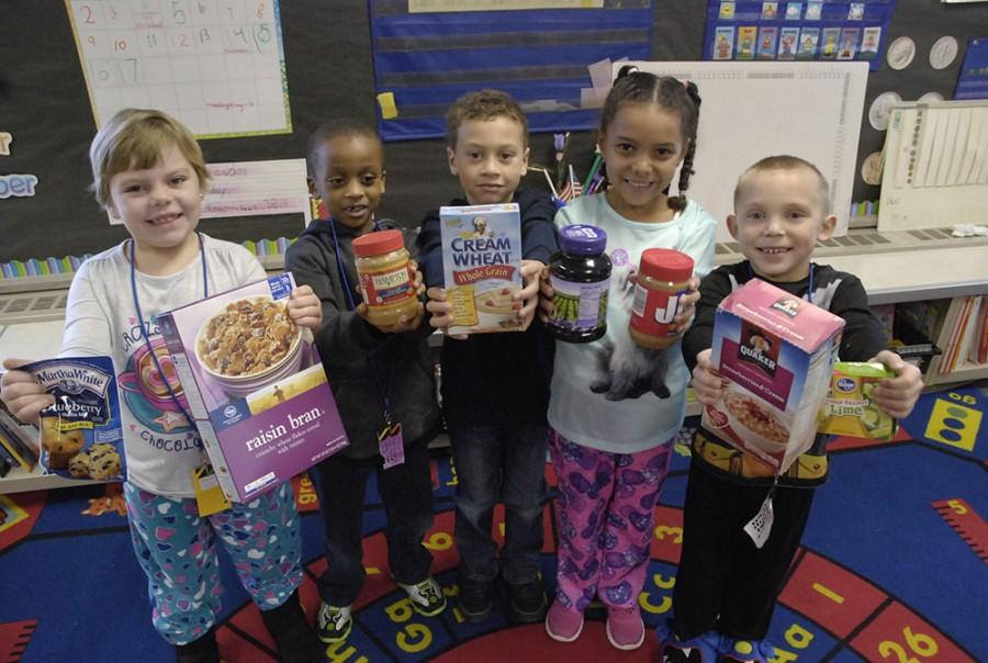  Students at Robey Elementary in the MSD of Wayne Township display some of the goods they brought in for their Thanksgiving canned food drive. Pictured are Riley Kent, Nehamiah Short, Trayton Mitchell, Lola Norton, and Timothy Kjos.