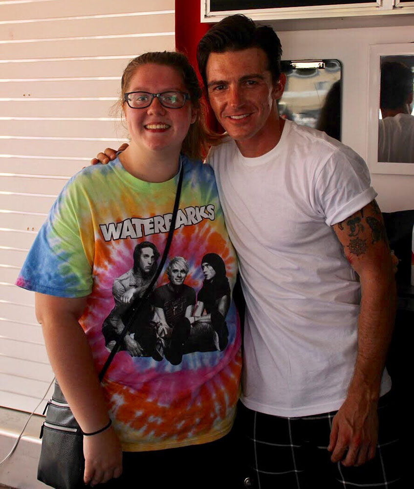 Co-editor Hera Boyd poses with Drake Bell after the High School Nation festival Wednesday afternoon.
