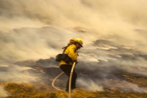 Santa Ana winds roar through Southern California, whipping fires on destructive path