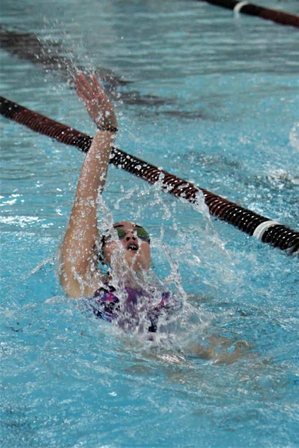 Junior Rachel Gaither swims the backstroke during a recent meet.