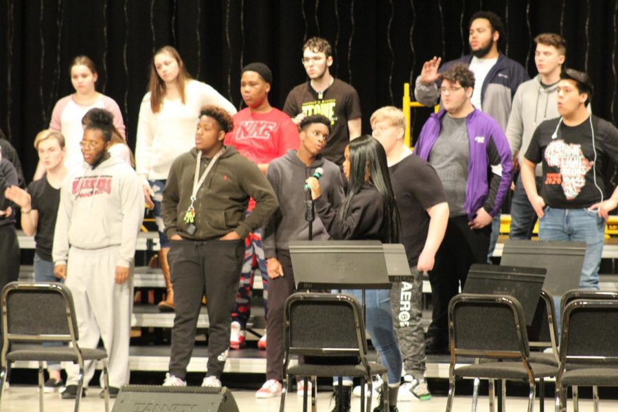 The choir practices in the auditorium Wednesday in preparation for Fridays Cabaret.