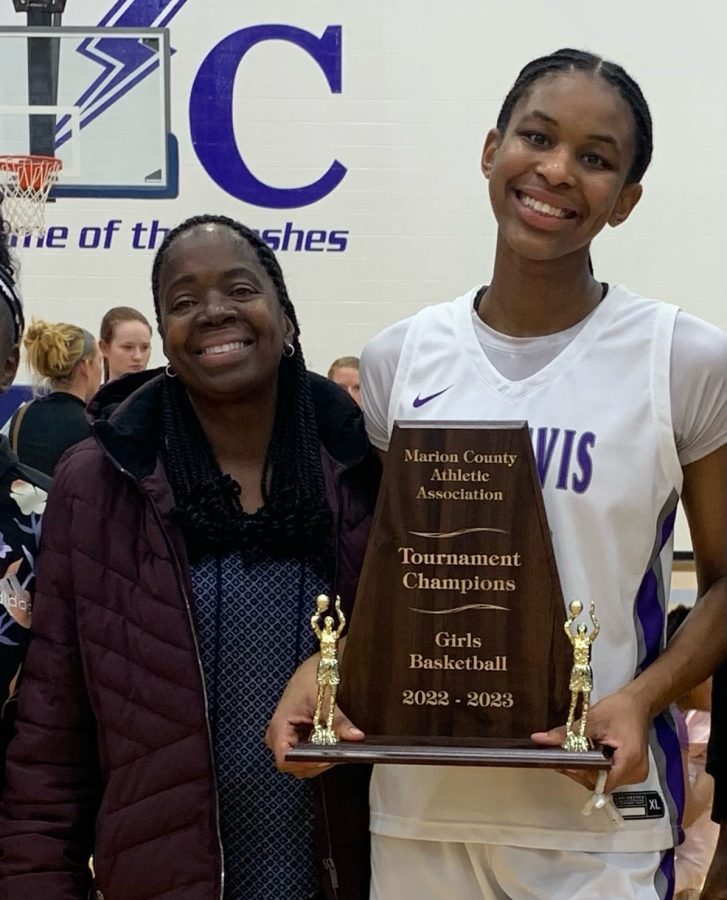 Head custodian Teresa Williams (left) with granddaughter Cristen Carter following the Giants winning the Marion County tourney.