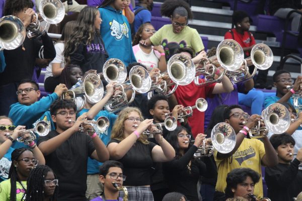 The band plays the school fight song during the fall pep rally.